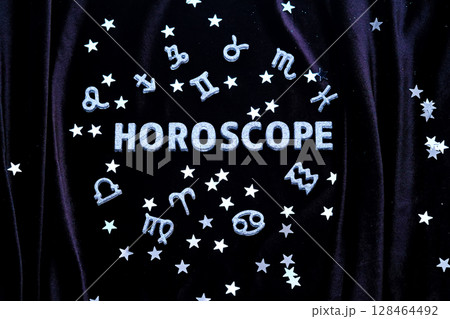 Horoscope inscription on a black velvet background. Horoscope inscription on a black velvet background. 128464492