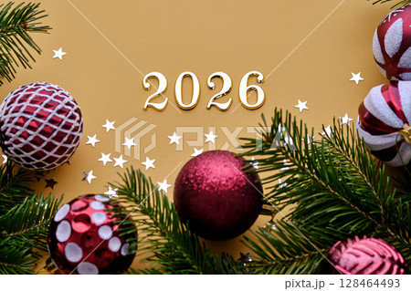 Yellow New Year's background with the number of the coming year 2026. 128464493
