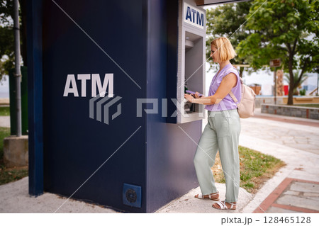 Exploring Greece's summer charm at a local ATM 128465128