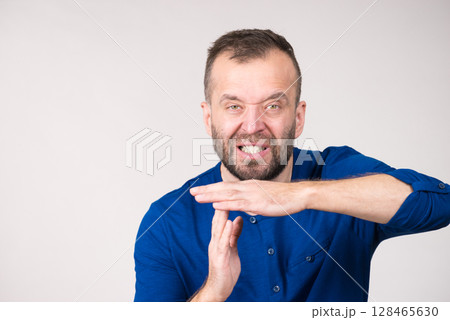 Man showing time stop gesture 128465630