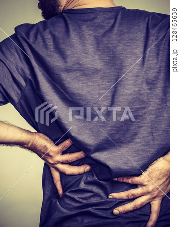 Man having back loins pain ache 128465639