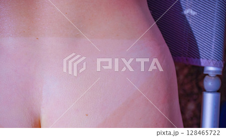 Woman body after taking off bikini with visible tan line from wearing panties Woman body after taking off bikini with visible tan line from wearing panties 128465722