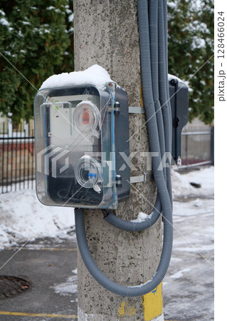 Electric meters near private homes hang on electric post Electric meters near private homes hang on electric post 128466024