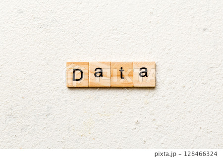 data word written on wood block. data text on table, concept 128466324