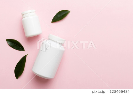 supplement pills with medicine bottle health care and medical top view. Vitamin tablets. Top view mockup bottle for pills and vitamins with green leaves, natural organic bio supplement, copy space supplement pills with medicine bottle health care and medical top view. Vitamin tablets. Top view mockup bottle for pills and vitamins with green leaves, natural organic bio supplement, copy space 128466484