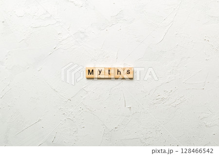 myths word written on wood block. myths text on table, concept 128466542