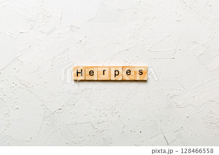 herpes word written on wood block. herpes text on table, concept 128466558
