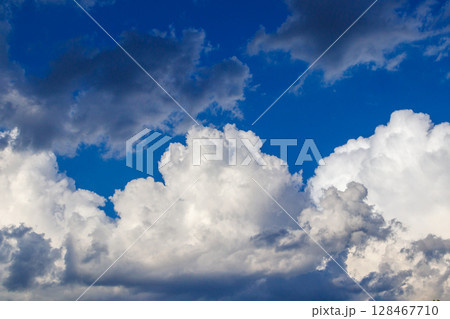 beautiful white clouds against the blue sky 128467710
