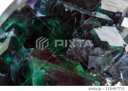 Macro mineral stone Fluorite on a white background Macro mineral stone Fluorite on a white background 128467731