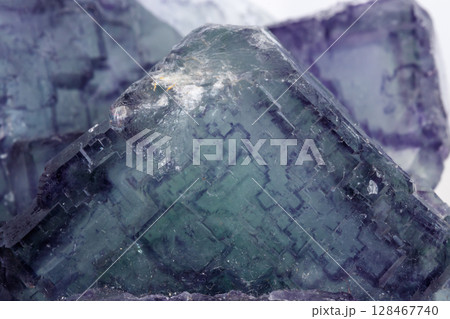 Macro mineral stone Fluorite on white background  128467740