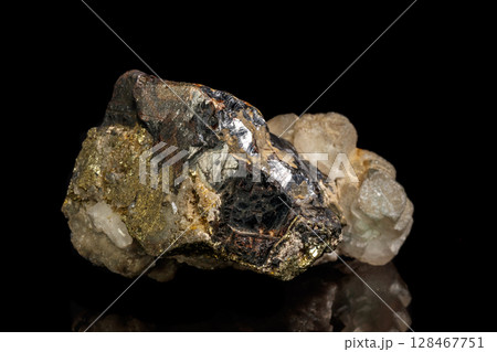 Macro of a mineral stone Sphalerite with fluorite and pyrite on a black background 128467751