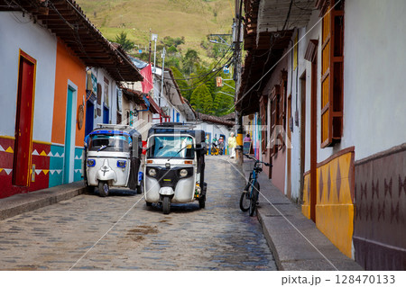 Traditional motor tricycle at the beautiful streets of the colonial town of Concepcion in Antioquia, Colombia. 128470133