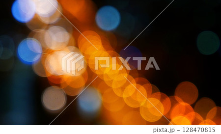 Blurred background night city bokeh car drive on road in nightlife. Light line traffic jam in black night. Blur street flare traffic motion movement. Cityscape Urban dark background twilight time 128470815