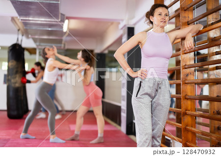 Women Standing Near Stairs Women Standing Near Stairs 128470932
