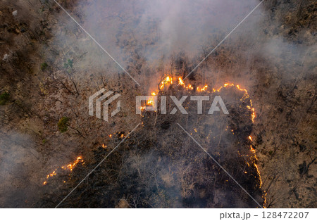 Wildfires release carbon dioxide (CO2) emissions and other greenhouse gases (GHG) that contribute to climate change. 128472207