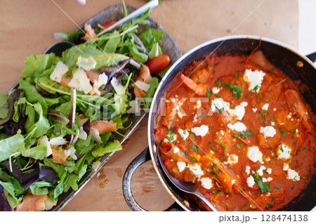 Fresh Salad and Savory Tomato Dish on Rustic Table Fresh Salad and Savory Tomato Dish on Rustic Table 128474138