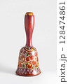 Decorative hand painted wooden hand bell. 128474861