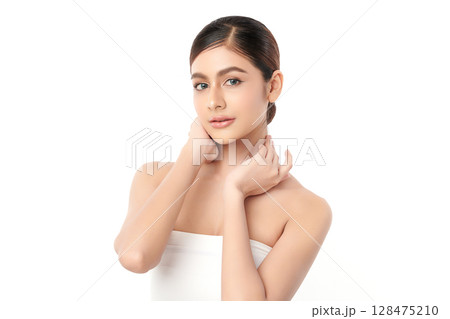 A beautiful young Asian woman with clean, fresh skin against a white background. Skincare, facial treatment, cosmetology, beauty, and spa. An elegant portrait of an Asian woman. A beautiful young Asian woman with clean, fresh skin against a white background. Skincare, facial treatment, cosmetology, beauty, and spa. An elegant portrait of an Asian woman. 128475210