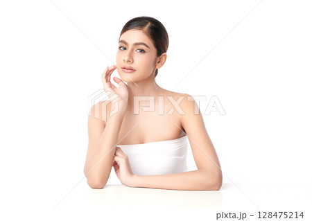 A beautiful young Asian woman with clean, fresh skin against a white background. Skincare, facial treatment, cosmetology, beauty, and spa. An elegant portrait of an Asian woman. A beautiful young Asian woman with clean, fresh skin against a white background. Skincare, facial treatment, cosmetology, beauty, and spa. An elegant portrait of an Asian woman. 128475214