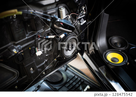 Technician installing the car speaker 128475542