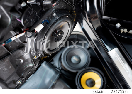 Technician installing the car speaker 128475552