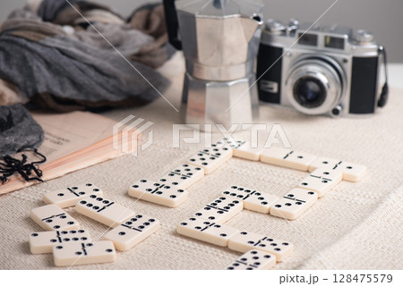 Playing Dominoes on the table Playing Dominoes on the table 128475579