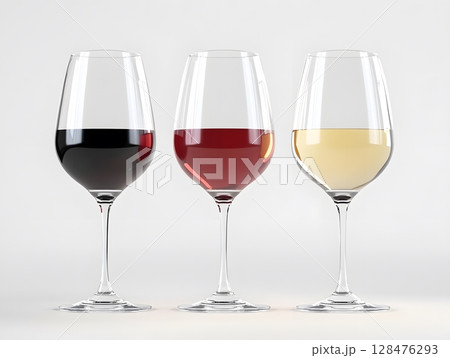 A row of three clear wine glasses filled with various wine, set on minimalist white background. 128476293