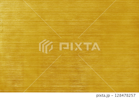 Golden yellow aluminium metal texture background, scratches on polished stainless steel. 128478257