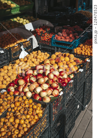 Fresh Fruits in Crates at Outdoor Summer Market 128478523