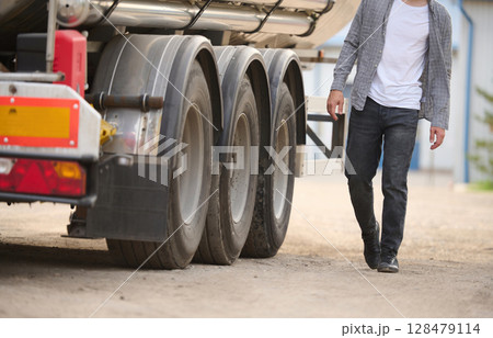 Young truck driver in casual clothes Young truck driver in casual clothes 128479114