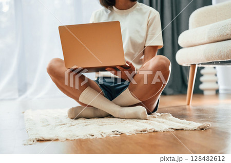 Close up view of woman that is using laptop Close up view of woman that is using laptop 128482612