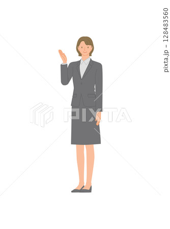 ビジネススーツを着た笑顔の若い女性：手で指し示す 128483560