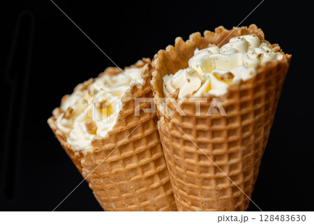 ice cream in a waffle cone 128483630