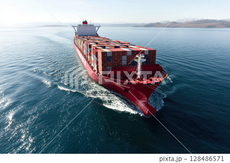 Large cargo ship navigating through calm waters, transporting containers 128486571
