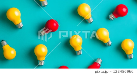 Colorful light bulbs on a vibrant turquoise background. Yellow, red light bulbs in a row on a color backdrop. Creativity, innovation, and bright ideas concept. Creative inspiration. Innovative notions 128486966