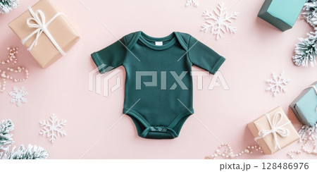 Dark green Baby onesie on pink Winter Holiday Festive Background. Fashion newborn clothes. Flat, top view. Baby kids soft organic cotton clothing. Infant trendy bodysuit product promo. Gender neutral 128486976
