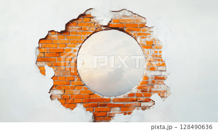 Circular opening in a brick wall revealing sky. Creative architecture and design concept Circular opening in a brick wall revealing sky. Creative architecture and design concept 128490636