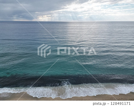 Sunset ocean waves. Sunset ocean horizon. High quality 4k footage 128491171