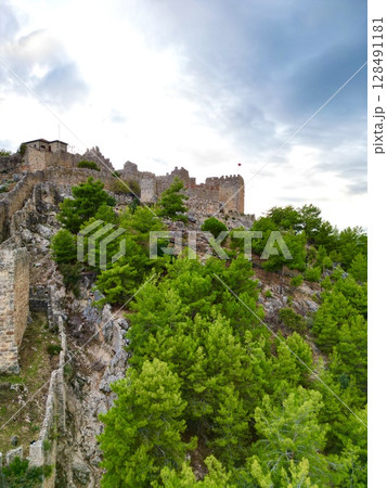 Rocky cliff castle Tower seaside ruins Ancient stone ruins. High quality photo 128491181