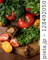 Fresh Tomatoes Herbs Wooden Cutting Board 128492050