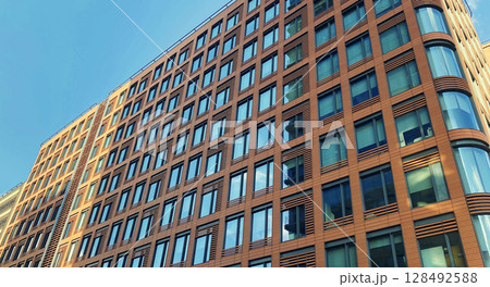 Architecture and real estate, modern residential apartment building with large panoramic windows Architecture and real estate, modern residential apartment building with large panoramic windows 128492588