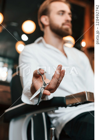 Handsome barber is in the salon Handsome barber is in the salon 128492742