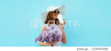 Summer beautiful lovely happy young woman with bouquet of purple lilac flowers in white straw hat 128493000