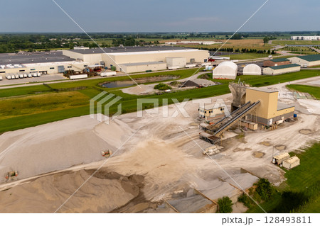 Large cement plant in field Large cement plant in field 128493811