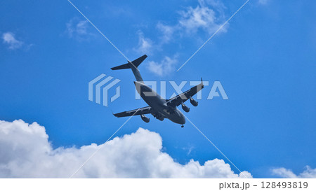 A plane flying in the sky. 128493819