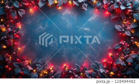 Festive winter background with christmas lights and holly leaves, winter holiday concept Festive winter background with christmas lights and holly leaves, winter holiday concept 128494482