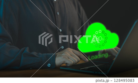 Person using a laptop computer with a glowing green cloud upload icon and loading progress bar, representing cloud computing, data transfer, internet of things, and digital technology. Person using a laptop computer with a glowing green cloud upload icon and loading progress bar, representing cloud computing, data transfer, internet of things, and digital technology. 128495083