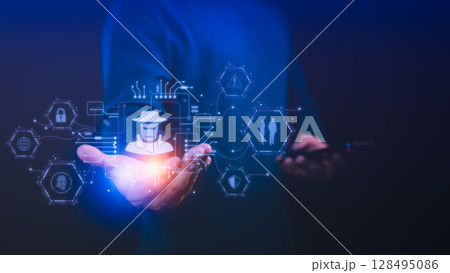 Person holding a smartphone with a glowing detective icon and cybersecurity symbols, Concept of online privacy, security cyber threats, data breaches, hacking and technology digital security risks. Person holding a smartphone with a glowing detective icon and cybersecurity symbols, Concept of online privacy, security cyber threats, data breaches, hacking and technology digital security risks. 128495086