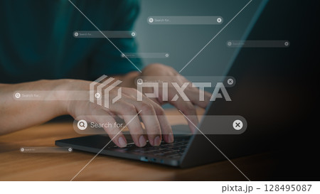 Focusing on a search bar with a magnifying glass icon. Concept of represents online searching, research, and digital information gathering. Male hand types on a laptop keyboard. 128495087