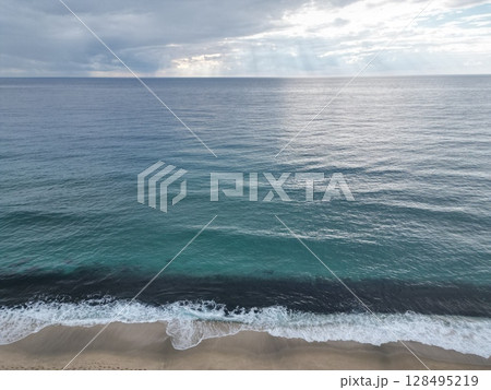 Sunset ocean waves. Sunset ocean horizon. High quality 4k footage Sunset ocean waves. Sunset ocean horizon. High quality 4k footage 128495219